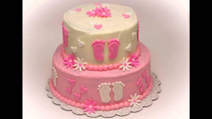 Lovely baby shower cake with princess footprint design and flowers