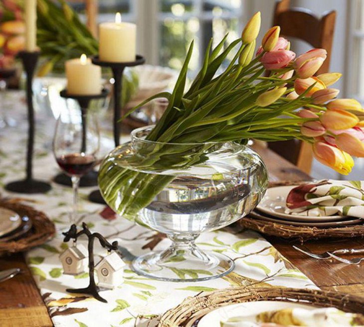 Lovely bunch of flowers in vessel of water for table decor