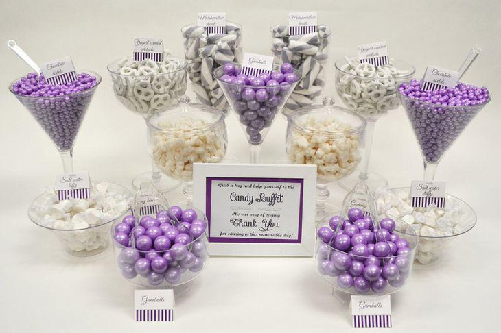 Lovely purple and white wedding candy buffet