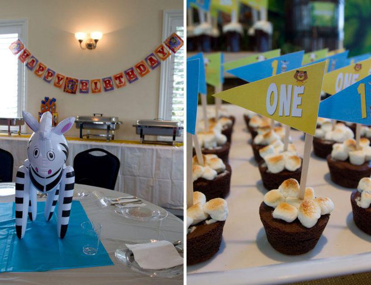 Madagascar themed guest table on boys 1st birthday party