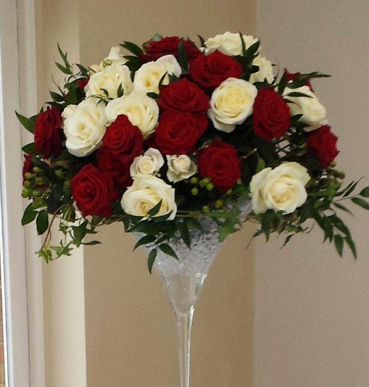 Martini glass decorated with red and white roses
