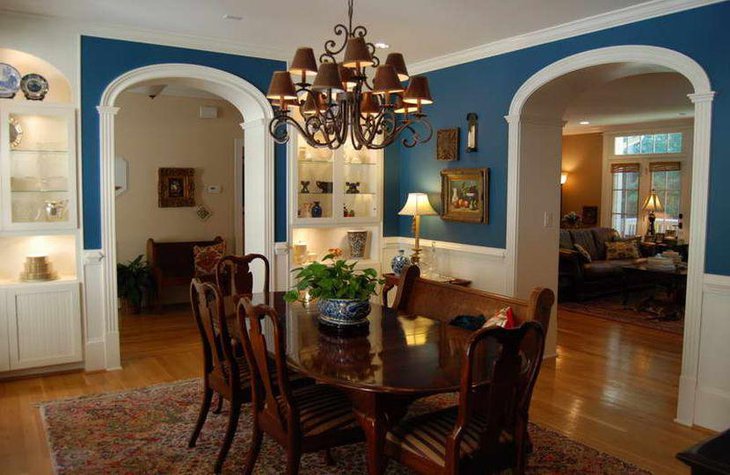 Modern Italian dinner table decorated with a planter