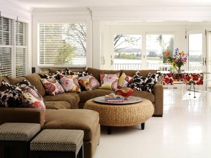 Modern knitted ottoman coffee table setting with books and colourful pot