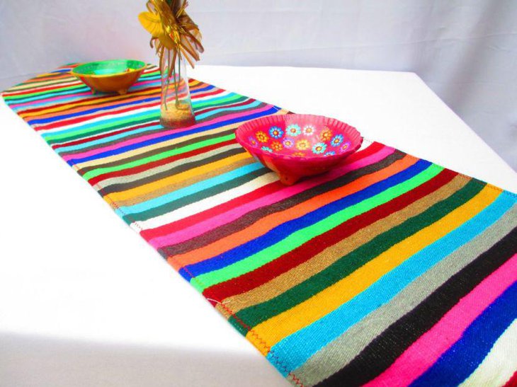 Multicolour serape decorated along with colourful bowls