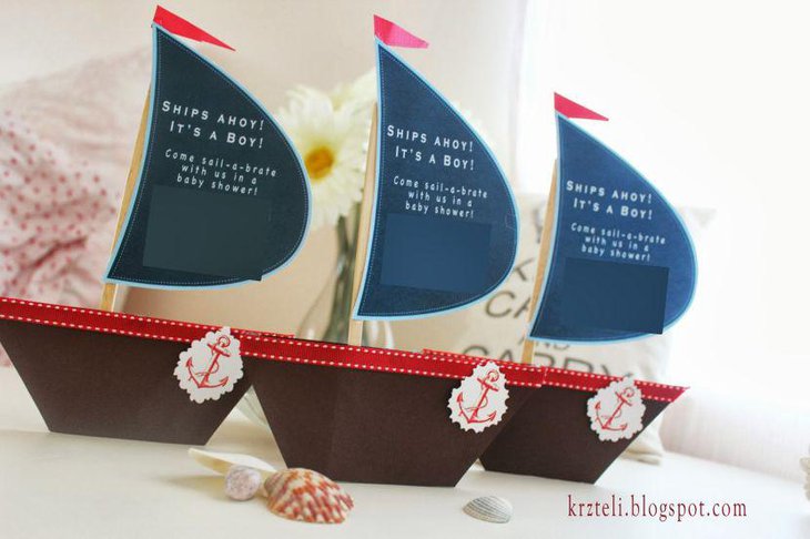 Nautical themed boy baby shower decor with sail boats