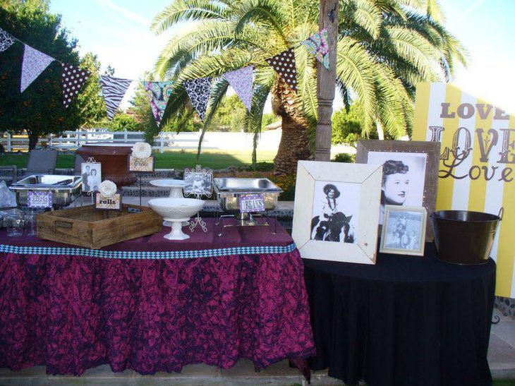 Outdoor 80th birthday table decoration with picture frames