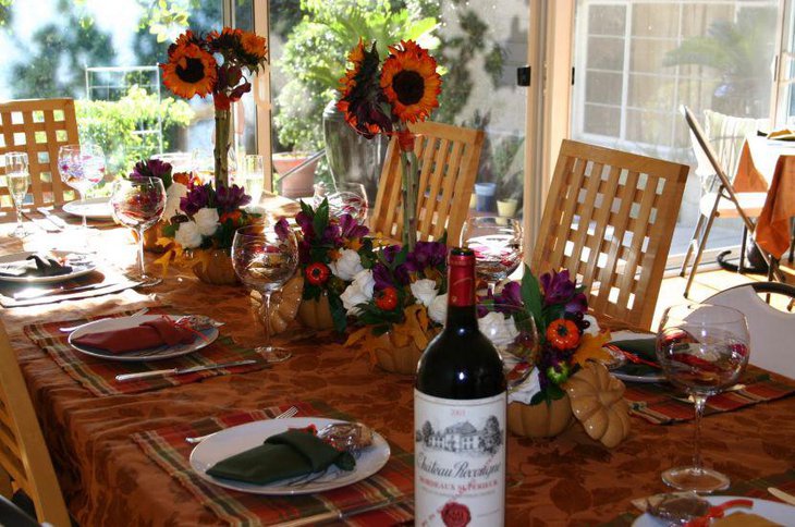 Outdoor Thanksgiving Table Decoration Alongside Pumpkin Bowl With Sunflower Arrangement Centerpiece