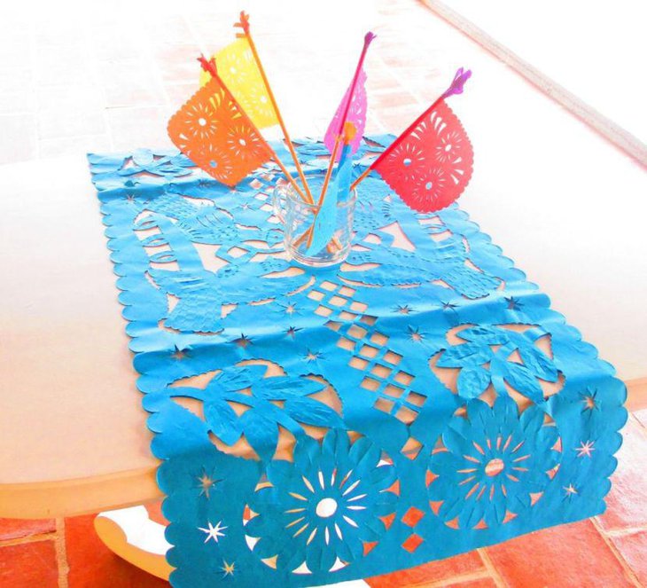 Papel picado table runner decor along with colourful flags