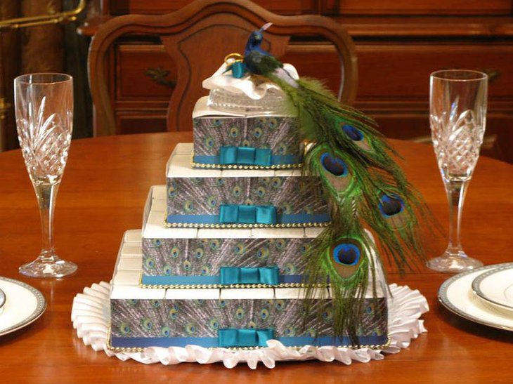 Peacock favor box centerpiece on a wedding table