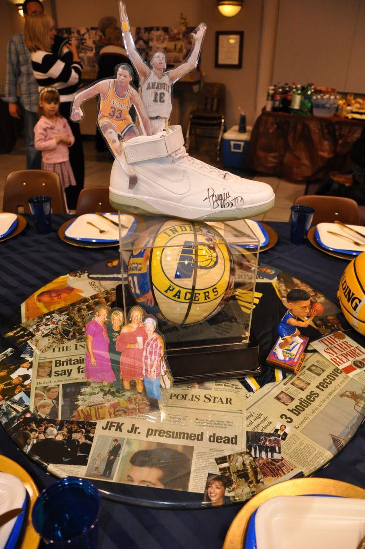 Personalised memoribilia displayed as a centerpiece on this 80th birthday table for a dad