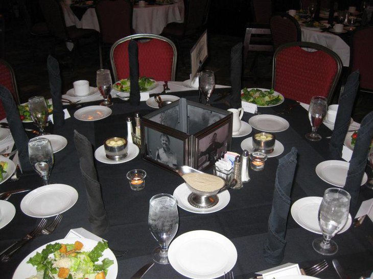 Photo framed glass retirement centerpiece on party table