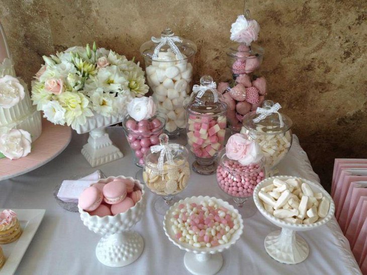 Pink and white dessert table decor for an engagement party