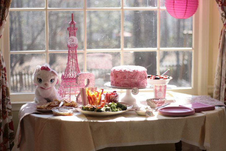 Pink Eiffel Tower centerpiece on a birthday table