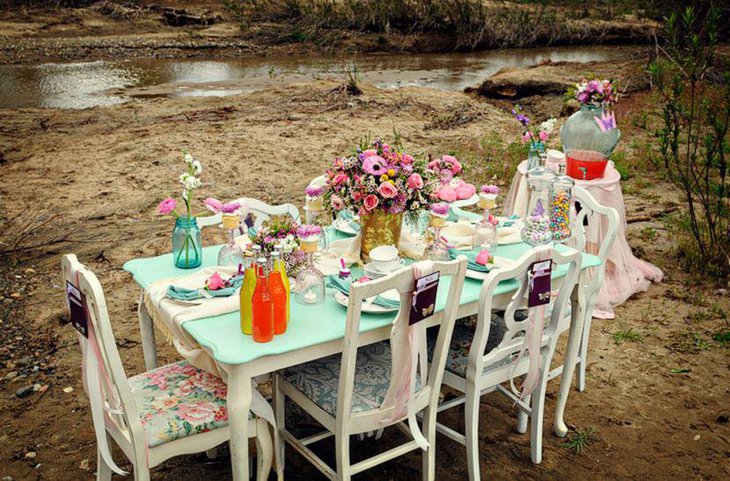 Pink floral centerpiece on garden party table