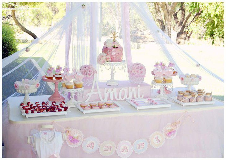 Pink pastel dessert table decor with pink cake