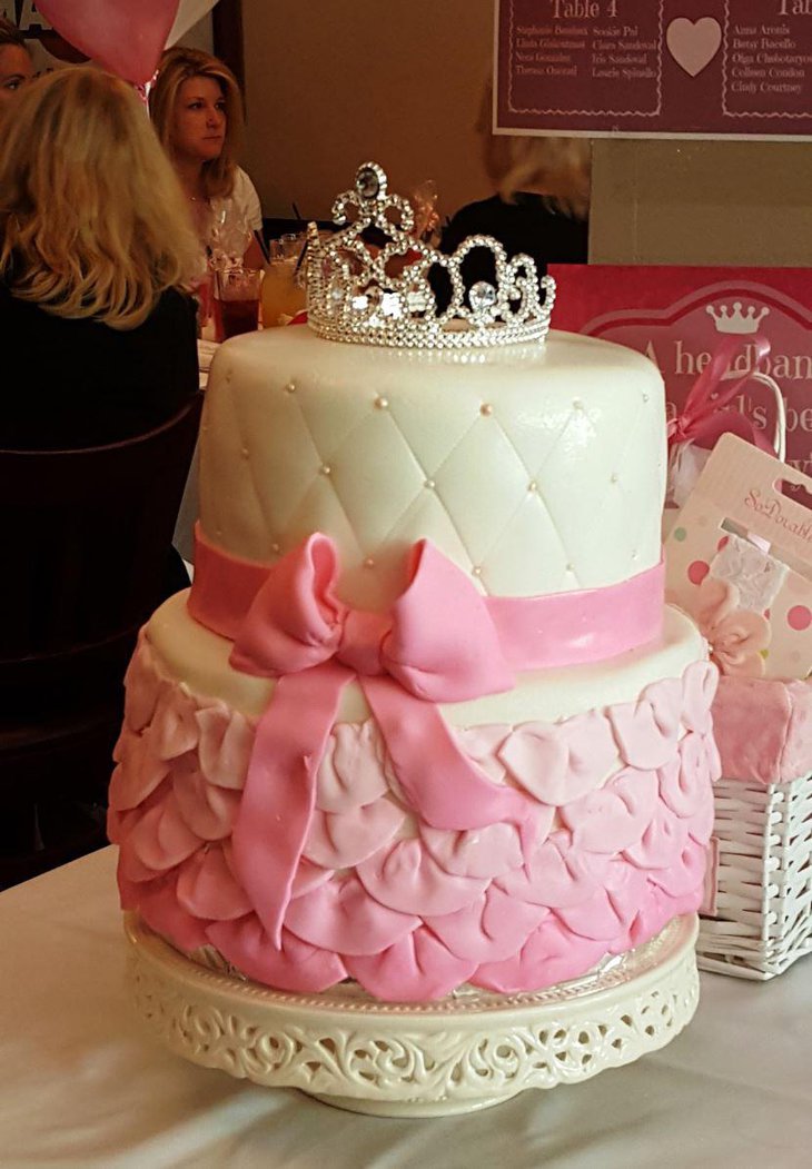 Pink princess baby shower cake with a tiara on top