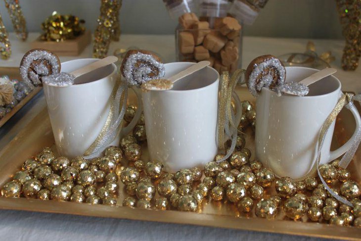Pleasing dessert tablescape using golden and silver treats