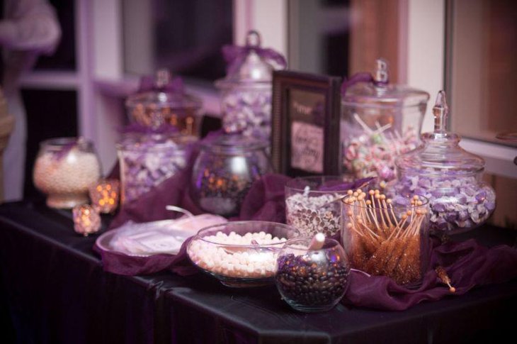 Pleasing purple wedding candy buffet table decor
