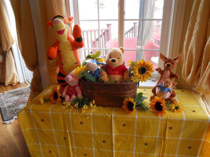 Pooh in the basket centerpiece for Winnie The Pooh baby shower table