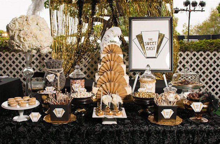 Pretty dessert table decor with gold and black accents