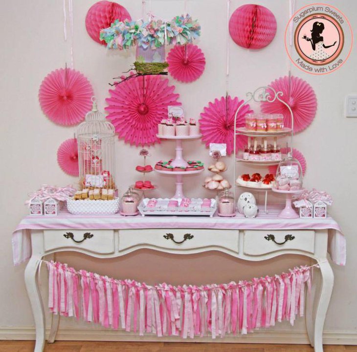Pretty pink dessert table design with owl decorations
