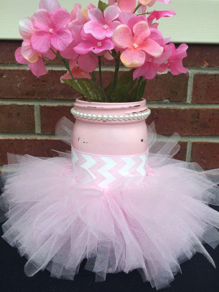 Pretty pink painted mason jar centerpiece for baby shower