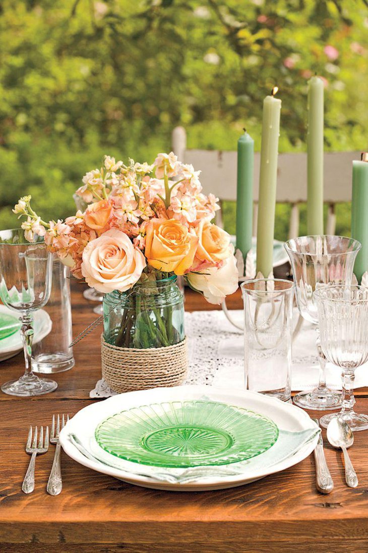 Pretty roses in a jar for decorating dinner table