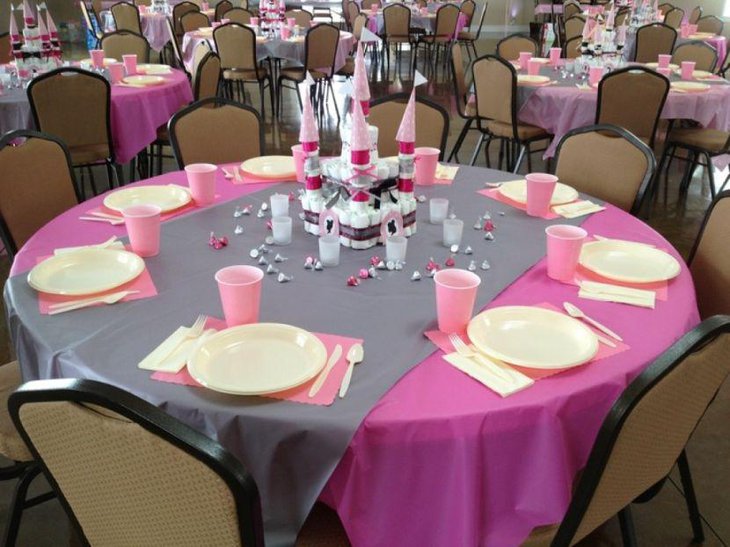 Princess baby shower guest table setting with castle centerpiece