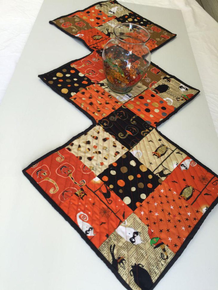 Quilted orange and black table runner