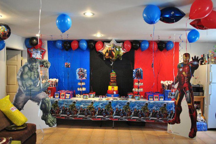 Red blue and black themed Avengers party table decor for kids