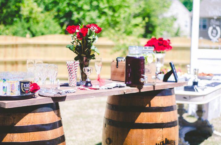 Red floral decor on a bridal shower table