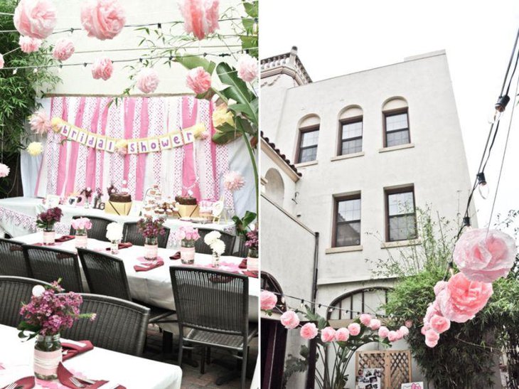 Romantic floral decor displayed on the outdoor bridal shower tables