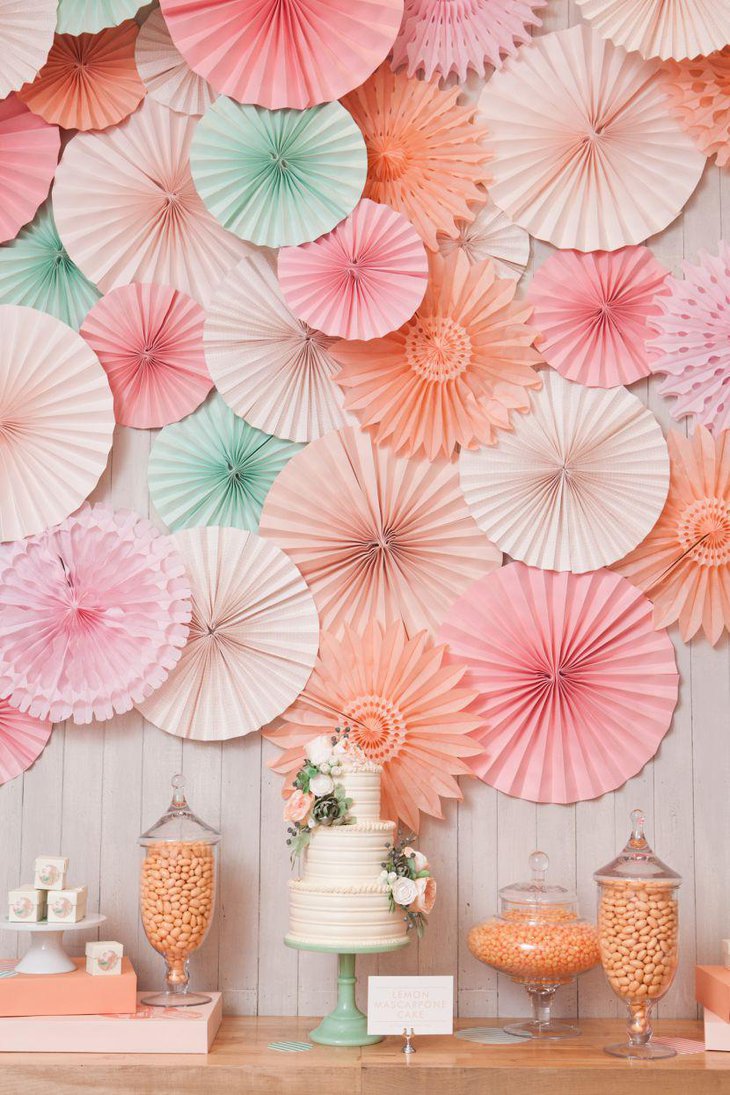 Romantic pinwheel backdrop decor on wedding cake table