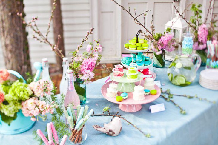 Romantic tablscape on this garden inspired bridal shower sweets table