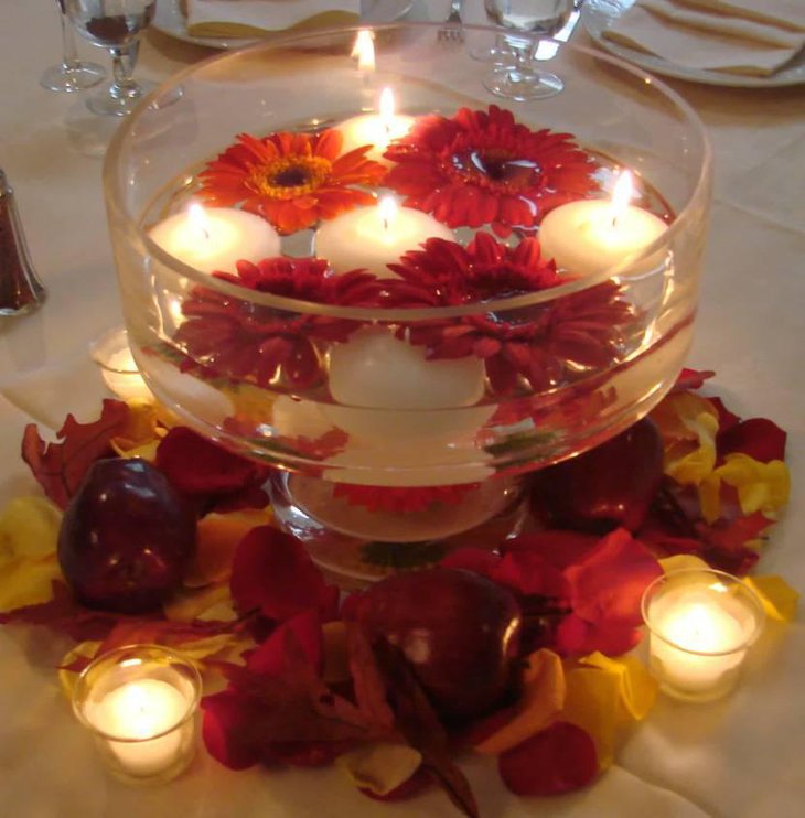 Round Glass With Floating Red Flowers And White Candles