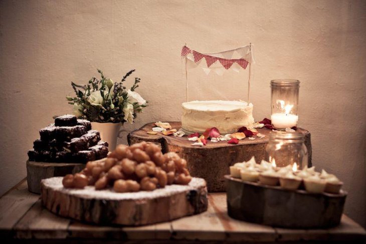 Rustic cake stand decor on wedding cake table