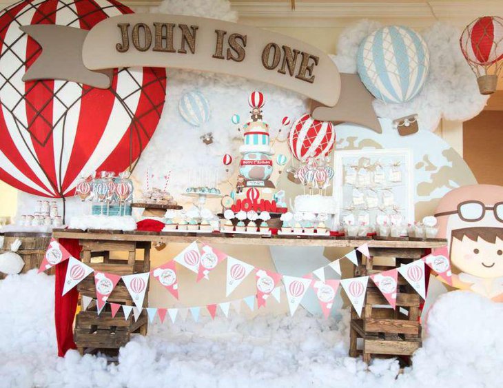 Rustic hot air balloon styled first birthday tablescape for boys