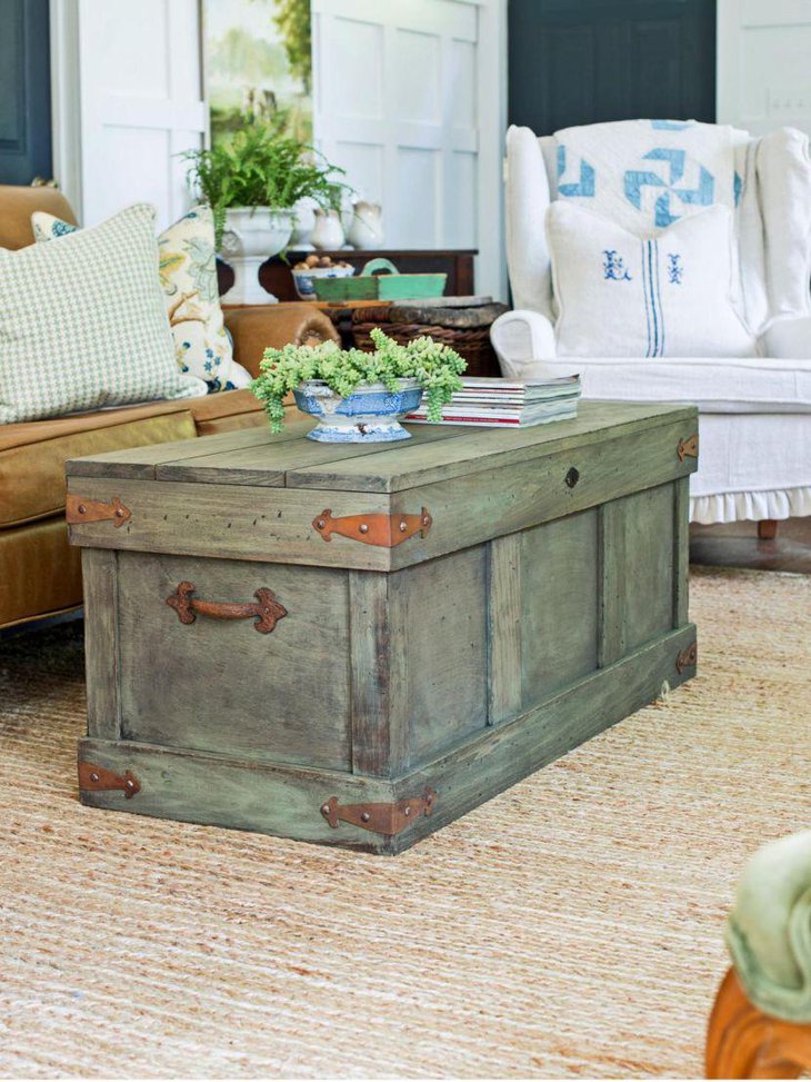 Rustic trunk styled coffee table adds a stylish touch to this living room