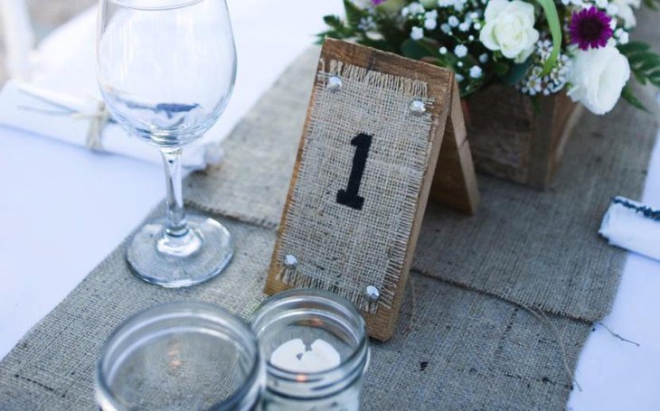 Rustic wood and burlap wedding table