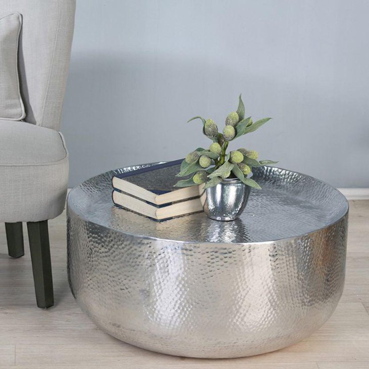 Silver coffee table decor with silver pot vase and books