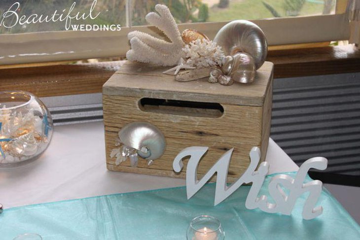 Silver decor on treasure chest wedding centerpiece