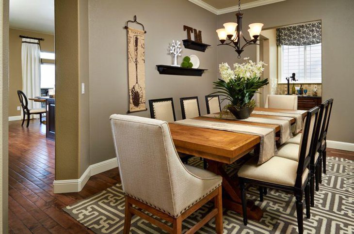 Simple dining table decor with floral centerpiece and metal chandelier