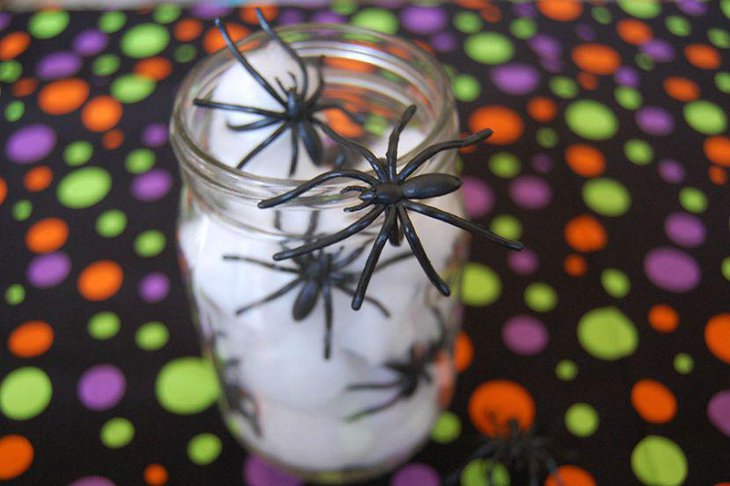 Spooky spiders crawling out of a jar decoration for kids Halloween