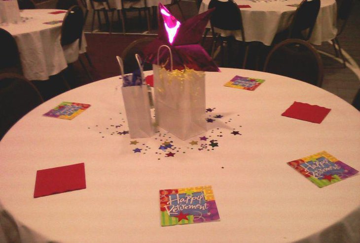 Star and ruffle filled bags as retirement table centerpieces