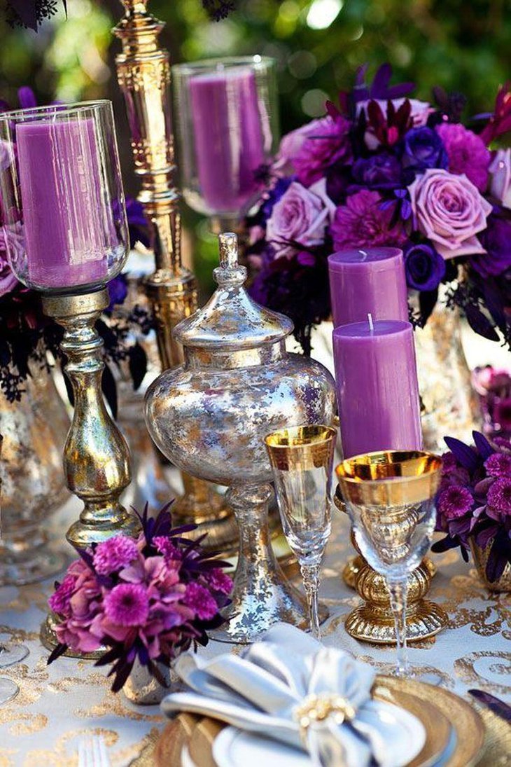 Striking purple wedding tablescape with purple candles