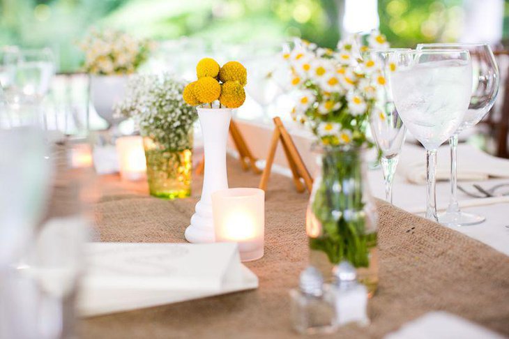 Stunning country wedding table decorated with yellow and white flowers