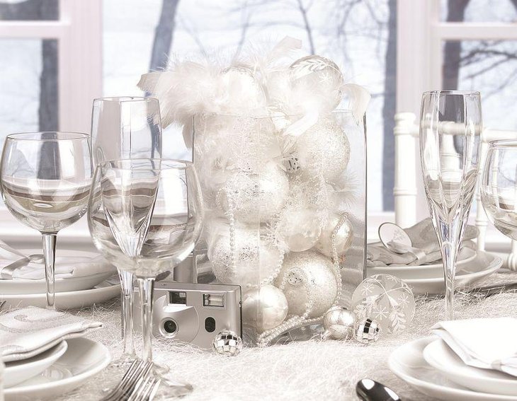 Stunning glass vase centerpiece filled with silver baubles and pearls