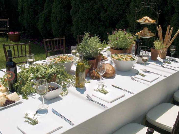 Stunning outdoor Italian themed table decor using greens