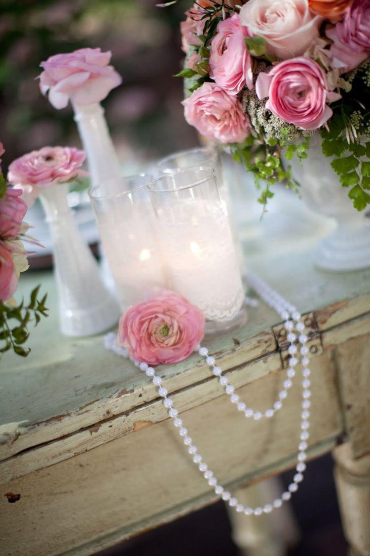 Stunning vintage wedding table decoration with white floral vases