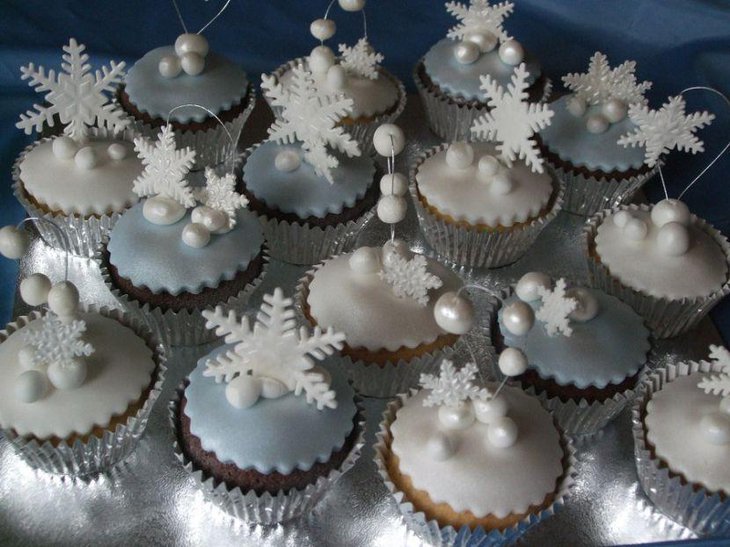 Stunning white and silver cupcakes with snowflake decor